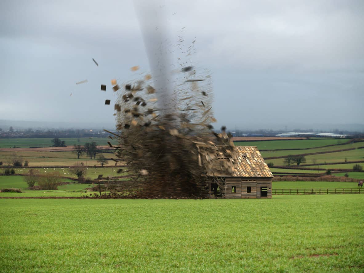 Tornado destroying a barn