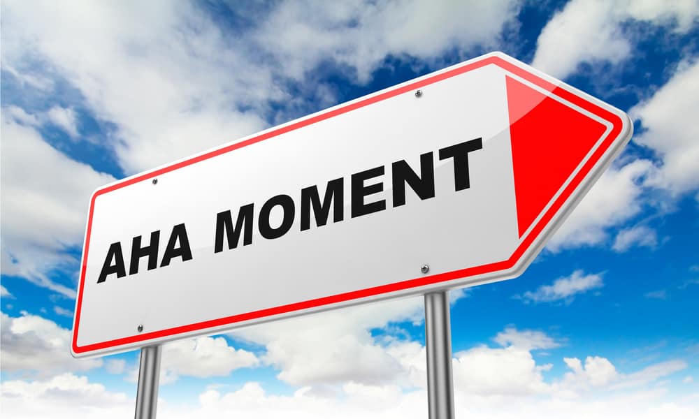 Aha moment sign with blue sky and clouds