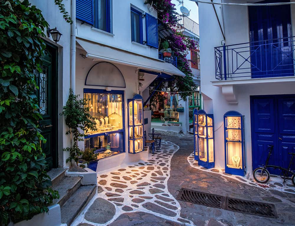 narrow alley with cobblestone in Skiathos, Greece