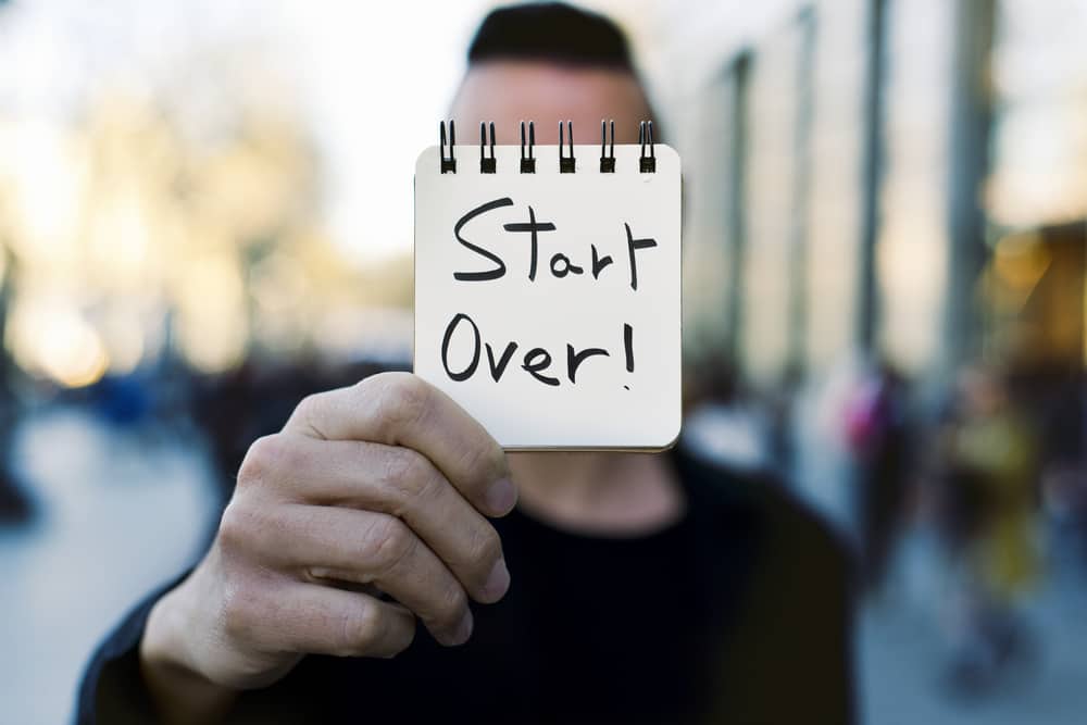 Man holding start over sign