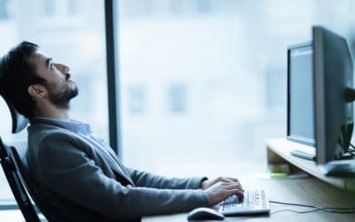 Man bored at computer