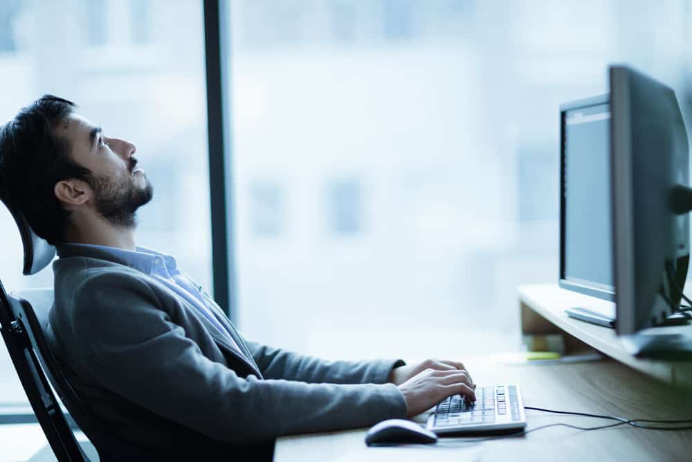 Man bored at computer