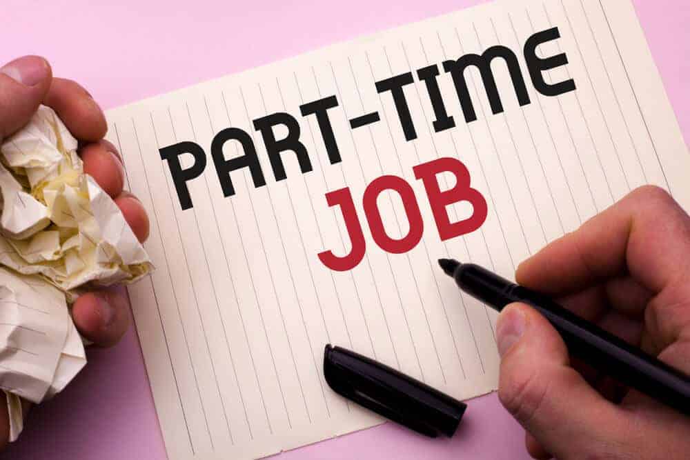 "Part-time job" written on a piece of paper using a marker.