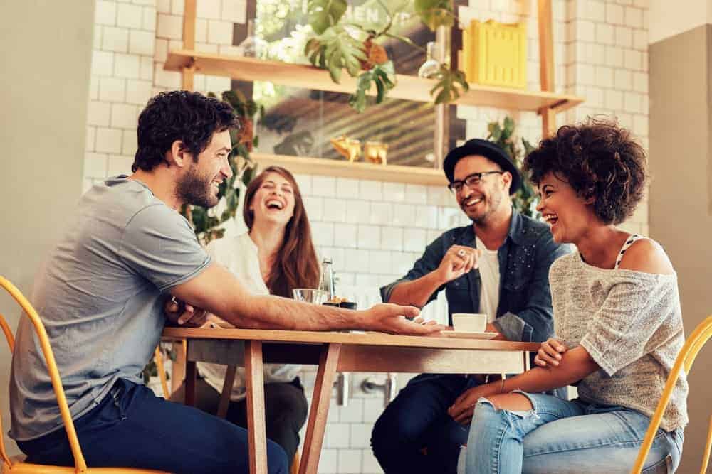 A group of friends hanging out in a cafe.