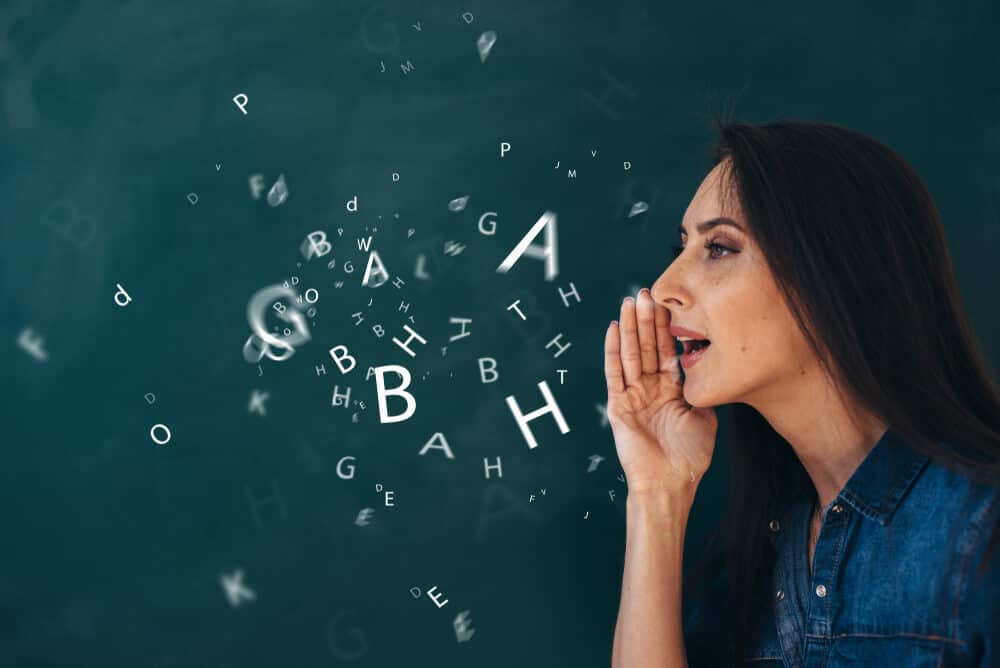 Letters coming from the woman's mouth to visualize speech.