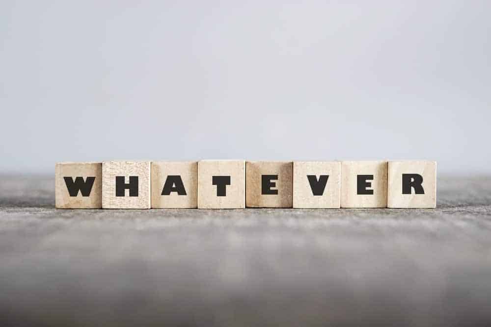 Wooden blocks of letters forming the word "whatever".