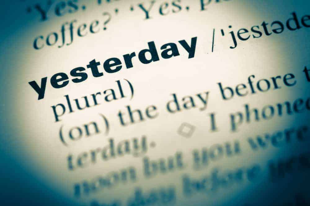 Closeup at dictionary highlighting the word "yesterday".