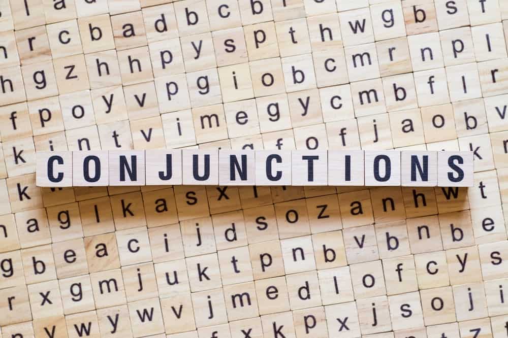 Word "conjunctions" formed from wooden cubes.