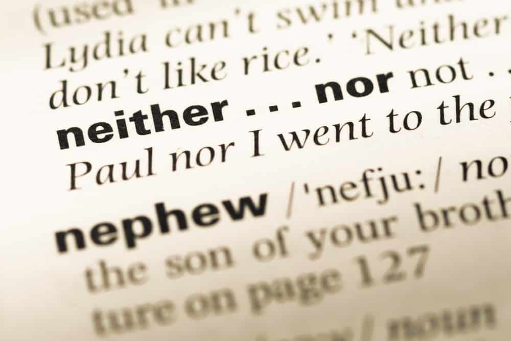 Close up of old English dictionary page focusing on the word "neither...nor".